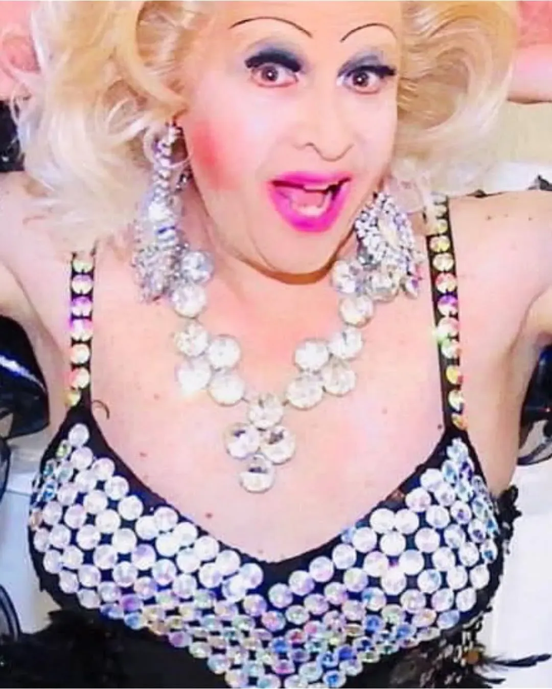 Tiffaney Wells in a sparkling outfit with blonde hair and jewellery